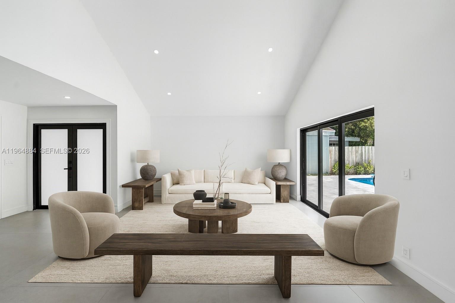 a living room with couches and a potted plant on a table