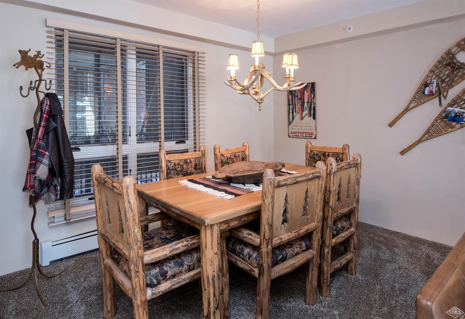 993 Lions Ridge Loop, Unit 325 Vail, CO 81657 - Photo 6 of 19 a view of a dining room with furniture and window