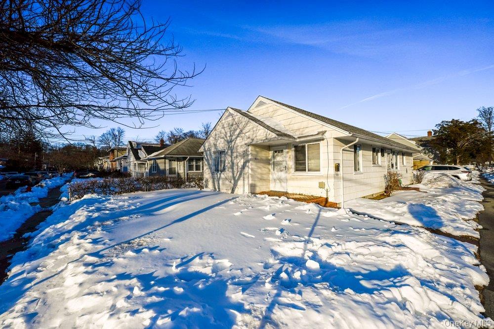 40 Firwood Road, Unit MAIN ST Port Washington, NY 11050 - Photo 2 of 18 a view of a house with a yard