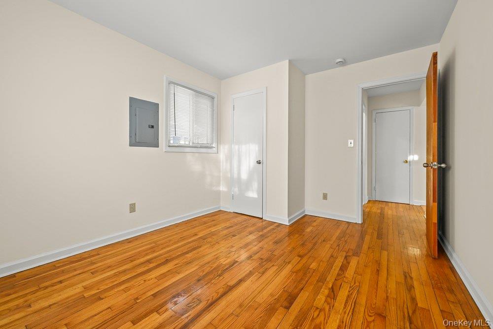 40 Firwood Road, Unit MAIN ST Port Washington, NY 11050 - Photo 8 of 18 a view of empty room with wooden floor