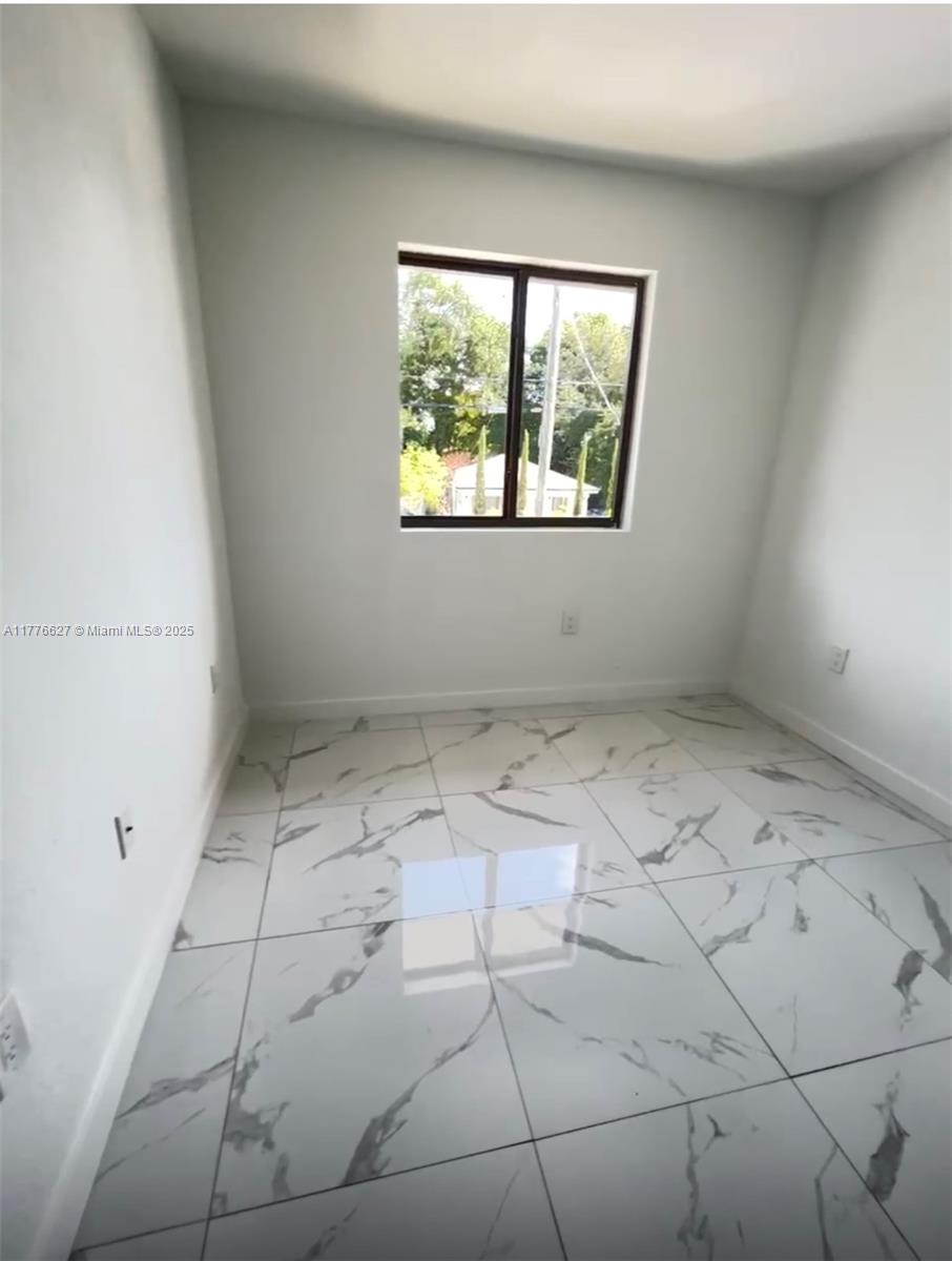 Brownsville Miami, FL 33142 - Photo 17 of 19 an empty room with windows