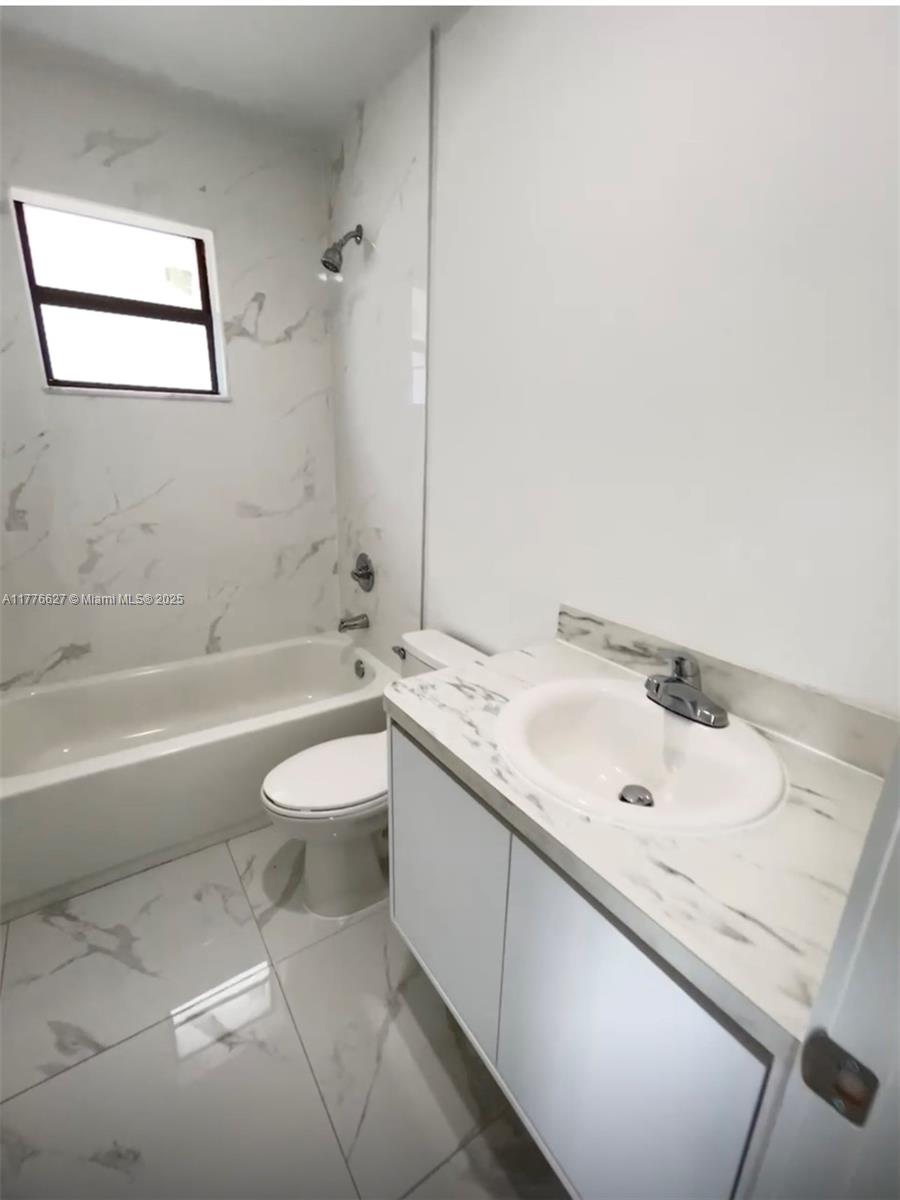 Brownsville Miami, FL 33142 - Photo 19 of 19 a bathroom with a sink and a toilet