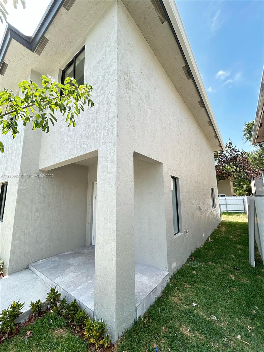 Brownsville Miami, FL 33142 - Photo 3 of 19 a house with garden in front of it