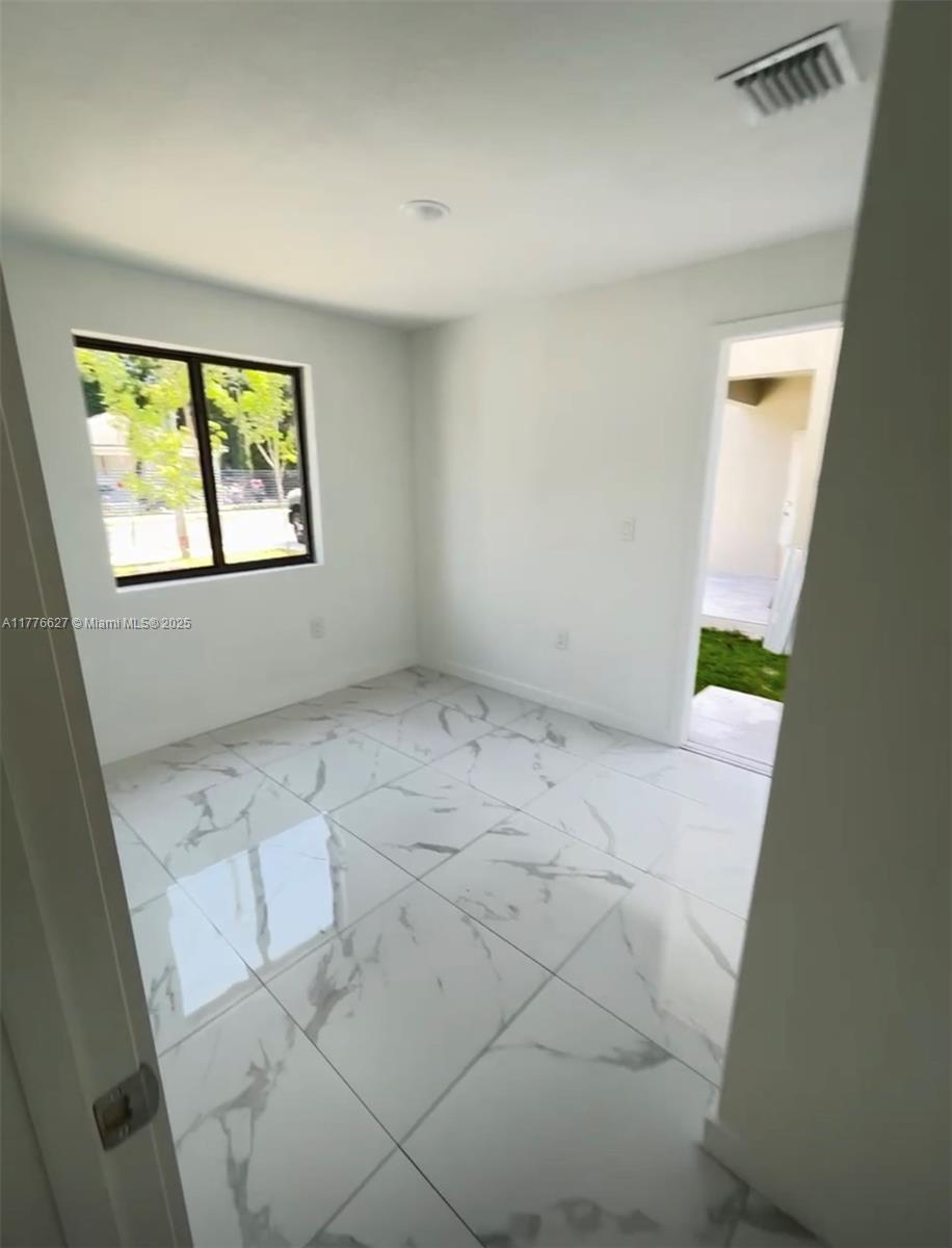 Brownsville Miami, FL 33142 - Photo 5 of 19 an empty room with windows