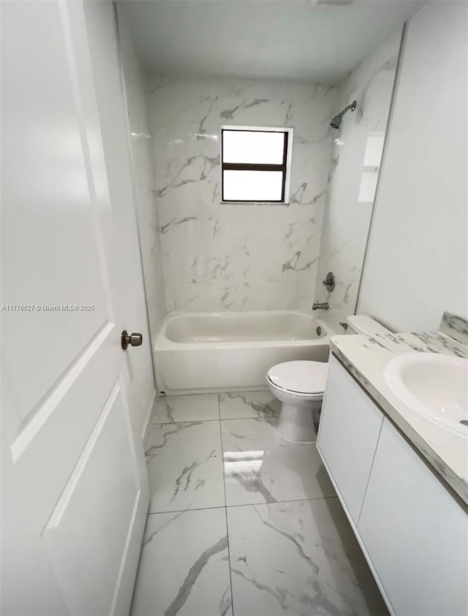 Brownsville Miami, FL 33142 - Photo 6 of 19 a bathroom with a sink toilet and bathtub