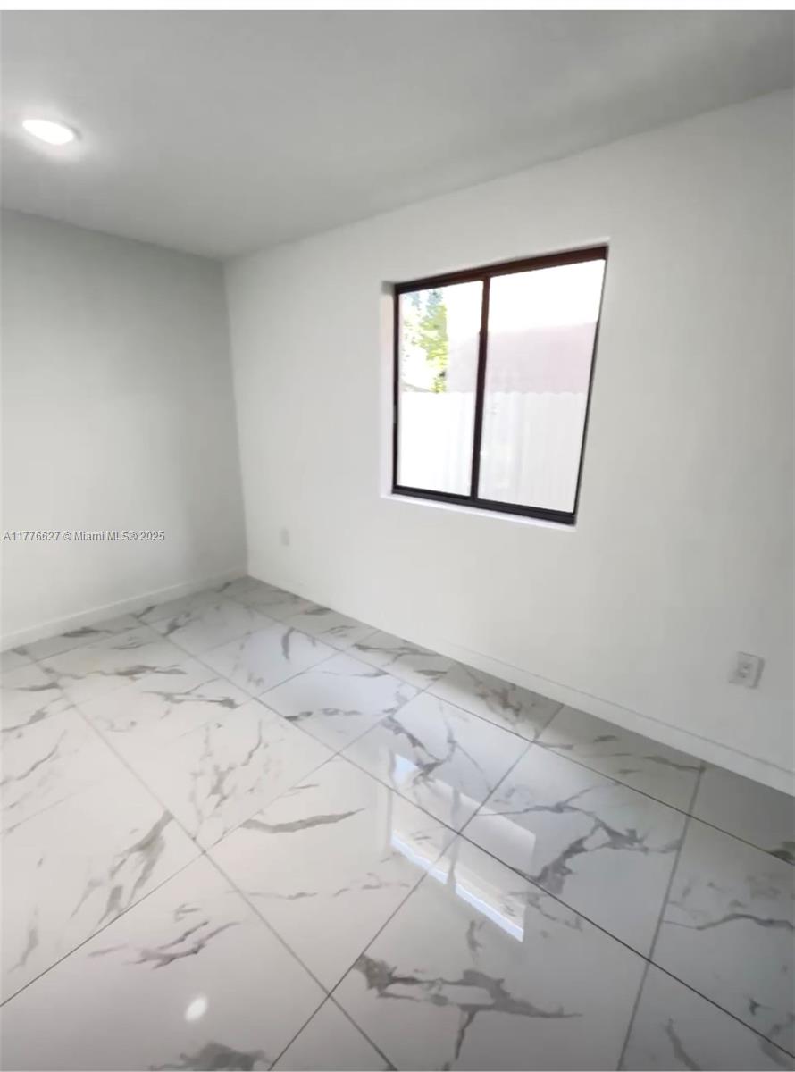 Brownsville Miami, FL 33142 - Photo 9 of 19 an empty room with windows