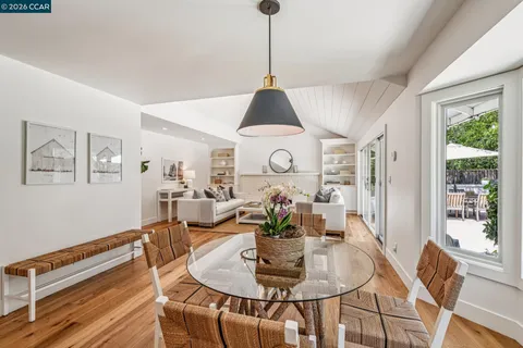 a living room with furniture and white walls