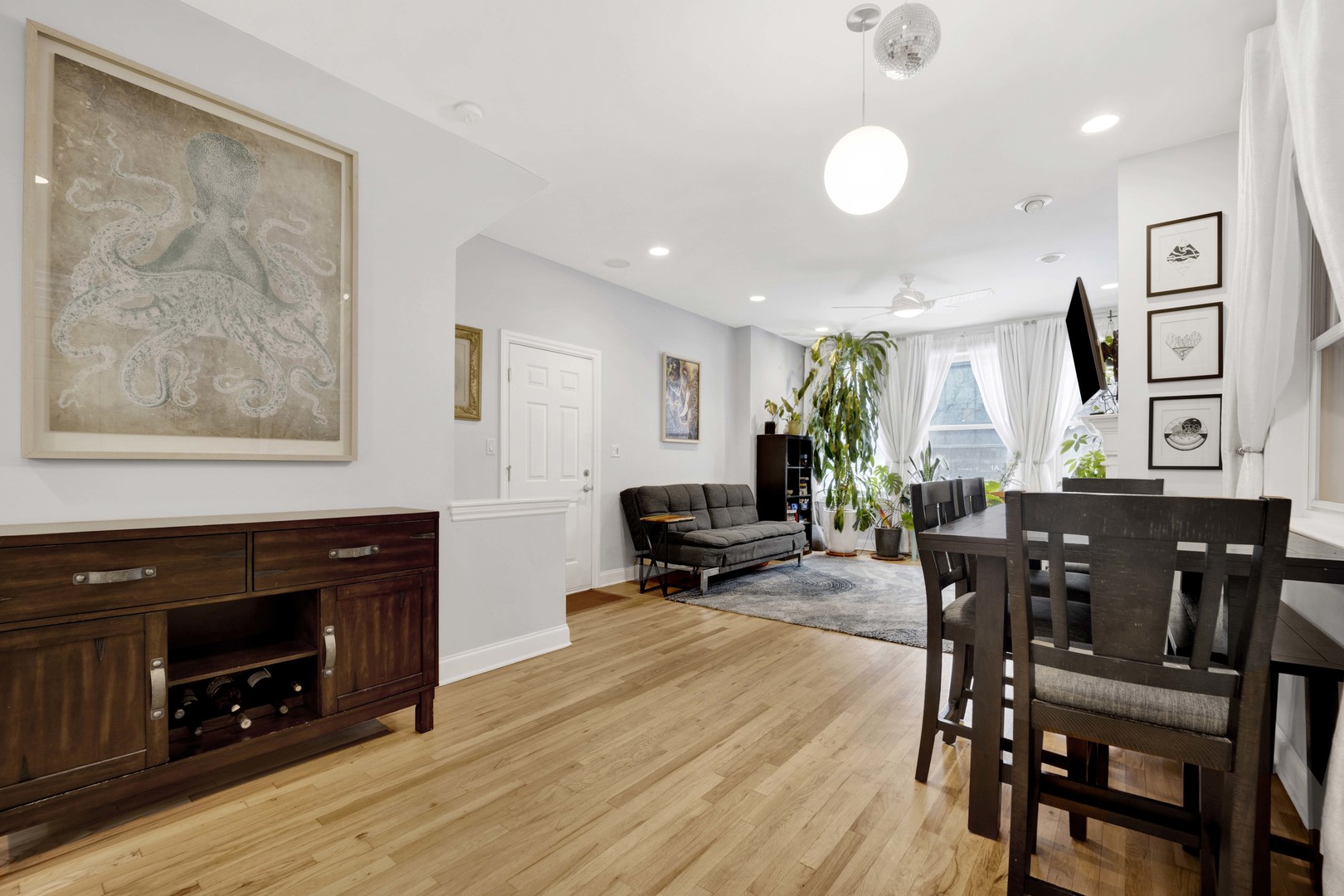 218 South Laflin Street, Unit 101 Chicago, IL 60607 - Photo 8 of 22 a view of a dining room with furniture and wooden floor