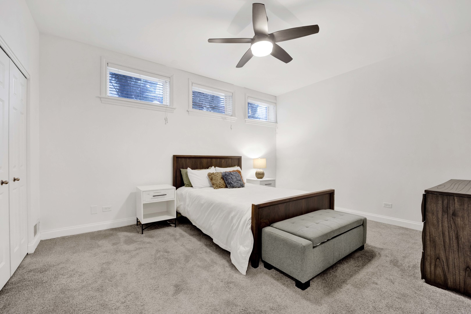 218 South Laflin Street, Unit 101 Chicago, IL 60607 - Photo 10 of 22 a bed room with a bed and a ceiling fan