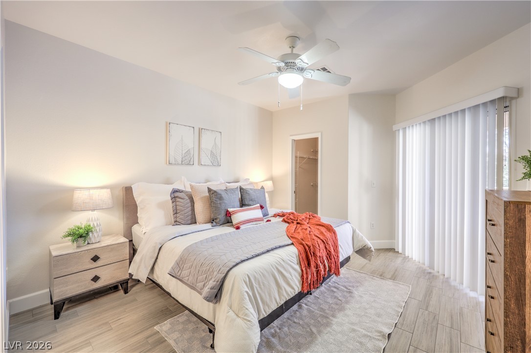 2050 West Warm Springs Road, Unit 1421 Henderson, NV 89014 - Photo 20 of 45 Relax in this well-appointed bedroom featuring a ceiling fan and convenient walk-in closet.