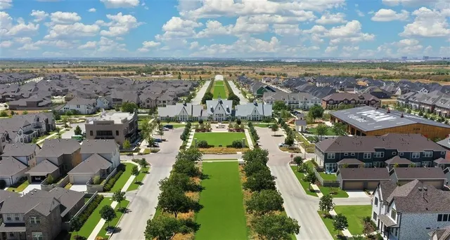 an aerial view of residential building and lake