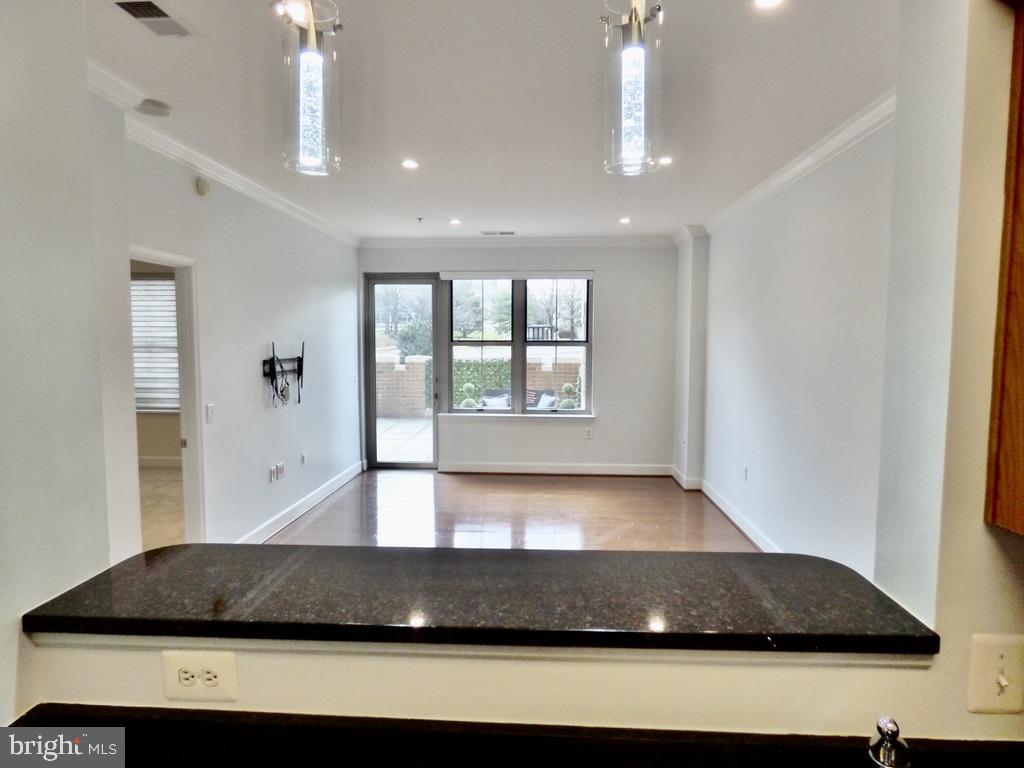 11800 Sunset Hills Road, Unit 118 Reston, VA 20190 - Photo 5 of 52 Spacious, light-filled living area.