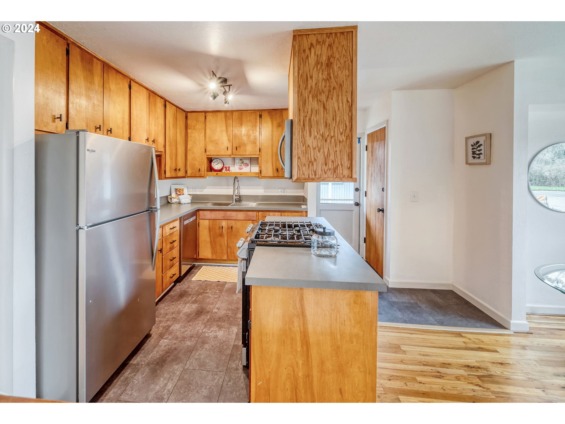 892 Sprague Street Eugene, OR 97405 - Photo 15 of 16 a kitchen with a refrigerator and a sink