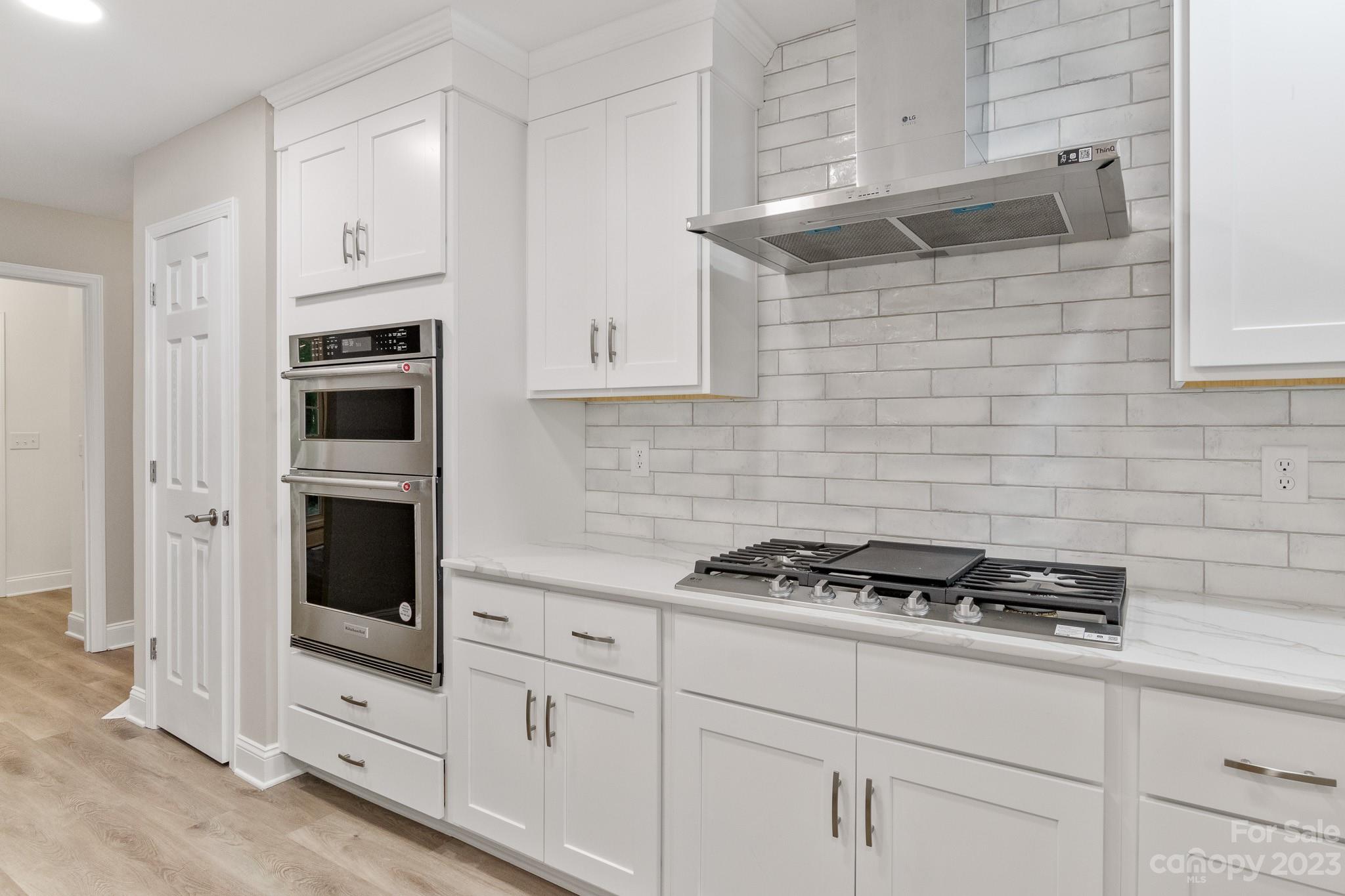 313 Faith Road Mooresville, NC 28115 - Photo 12 of 42 a kitchen with cabinets and appliances