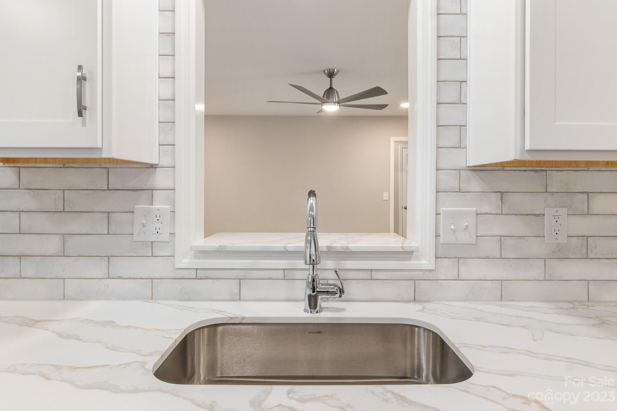 313 Faith Road Mooresville, NC 28115 - Photo 14 of 42 a close view of sink and tap