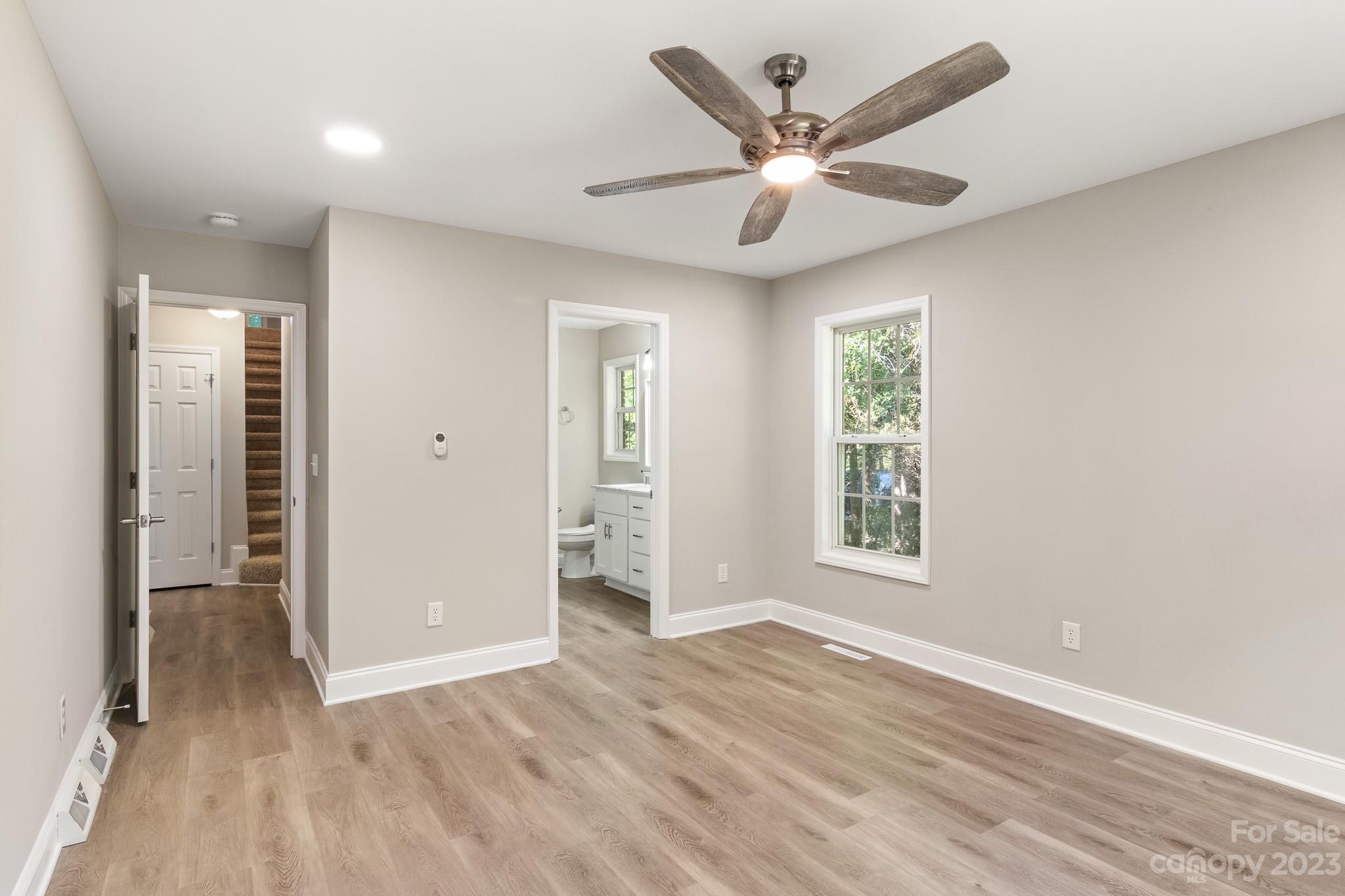 313 Faith Road Mooresville, NC 28115 - Photo 20 of 42 wooden floor in an empty room with a window