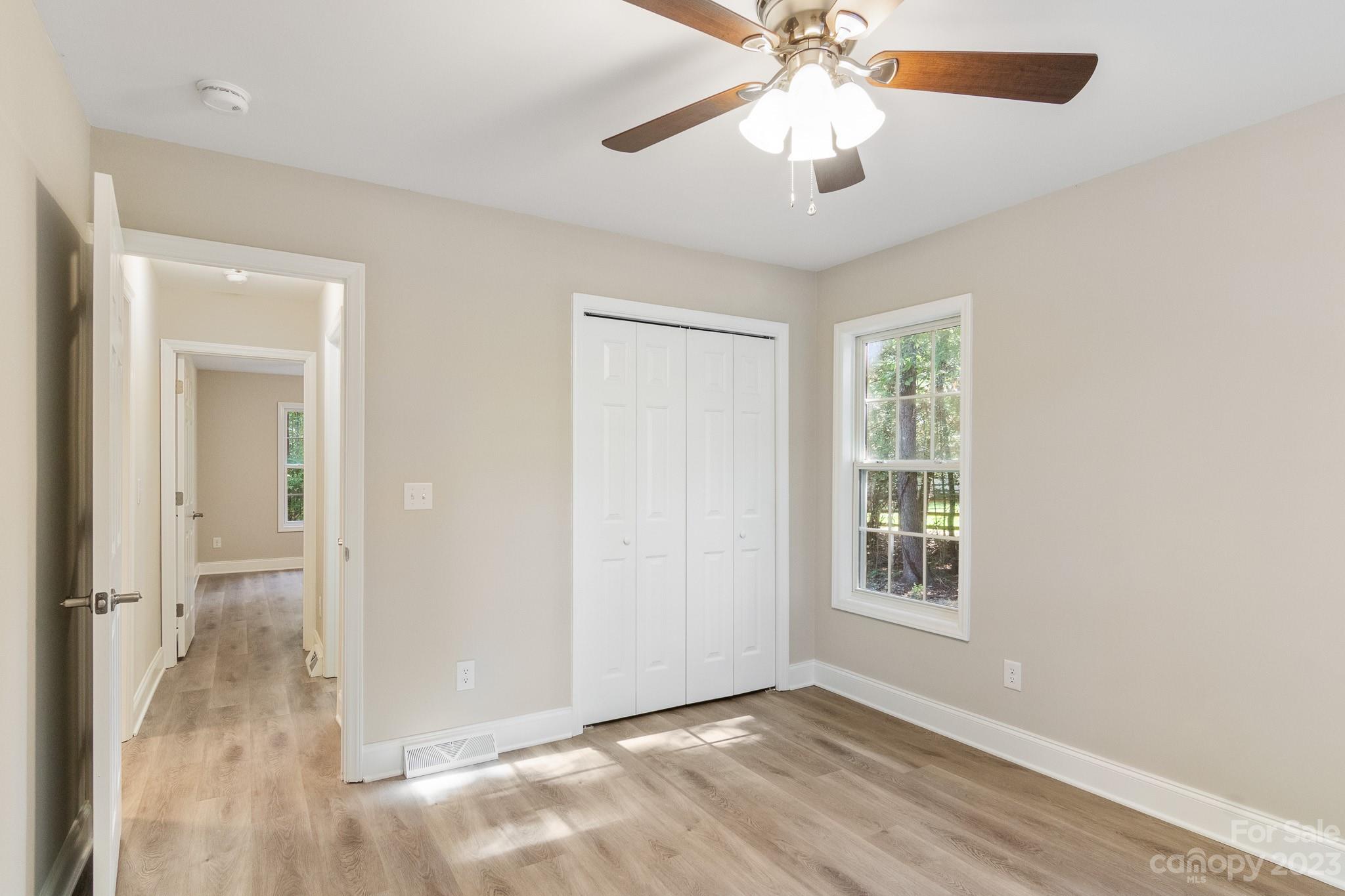 313 Faith Road Mooresville, NC 28115 - Photo 31 of 42 an empty room with fan and windows