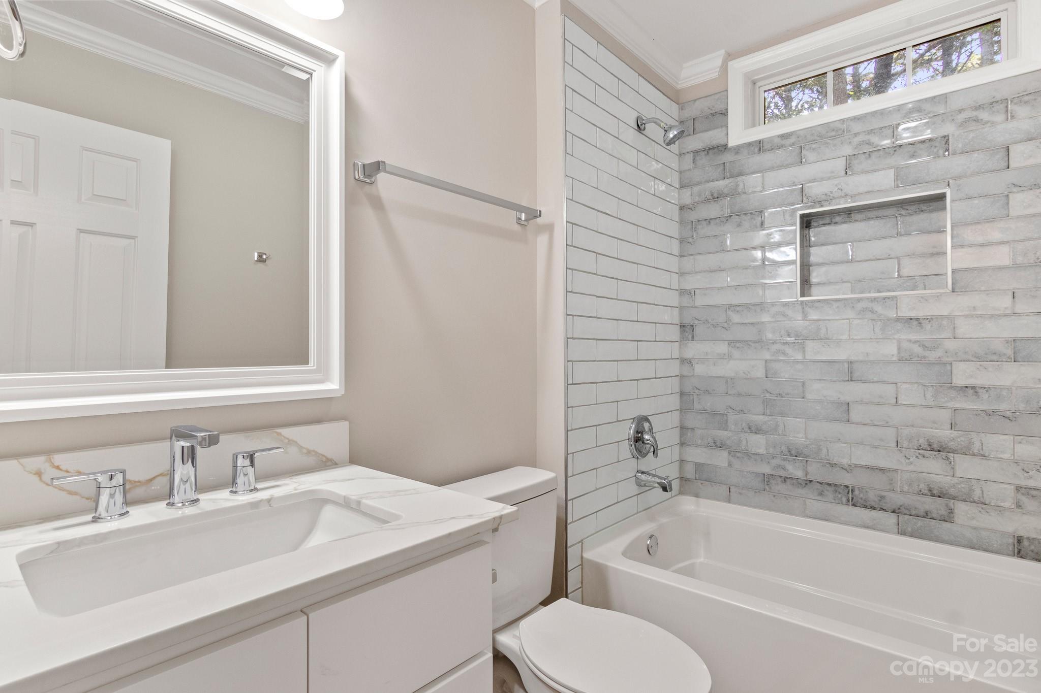313 Faith Road Mooresville, NC 28115 - Photo 34 of 42 a bathroom with a granite countertop sink toilet and bathtub