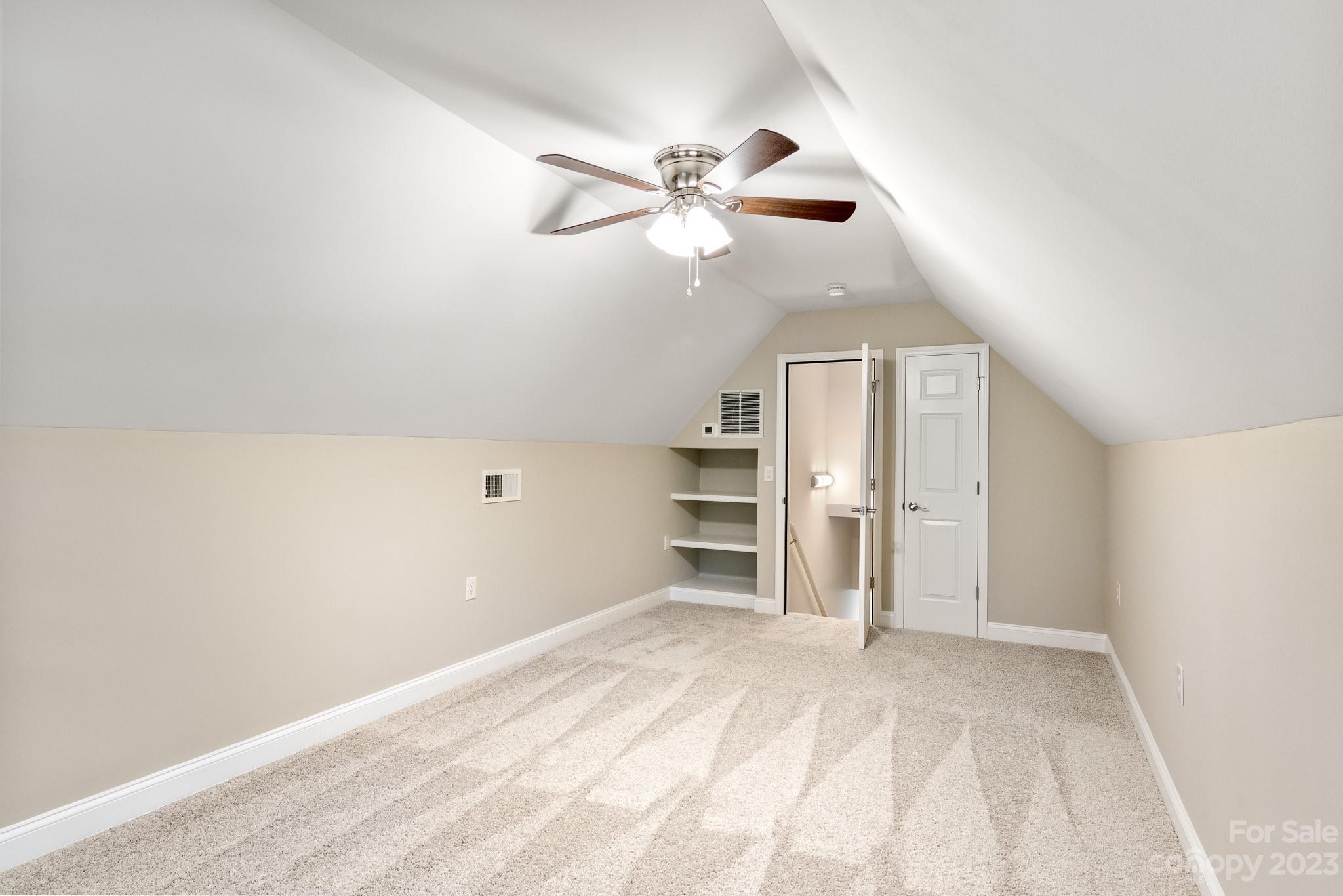 313 Faith Road Mooresville, NC 28115 - Photo 36 of 42 a view of a livingroom with a ceiling fan and window