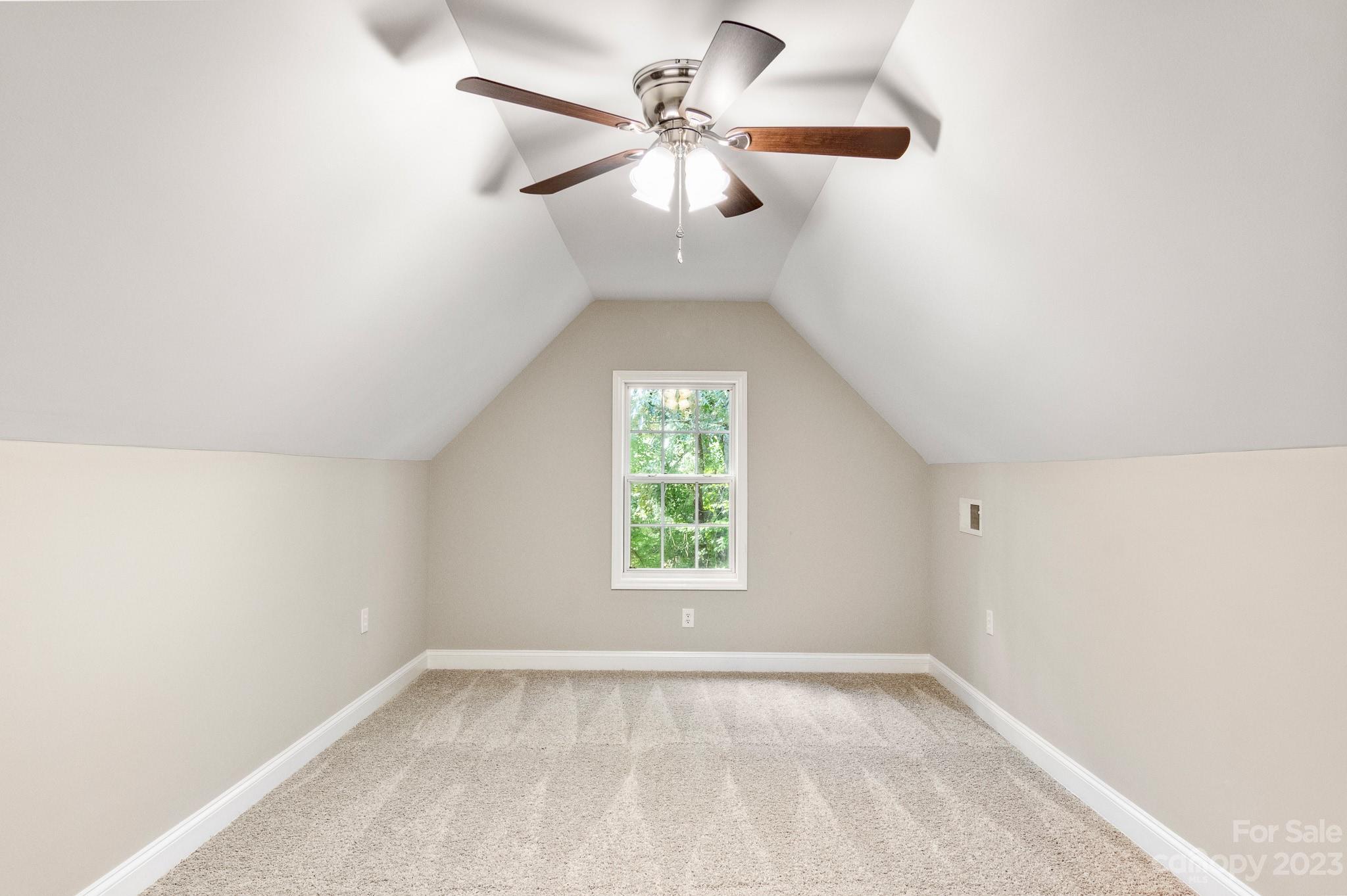 313 Faith Road Mooresville, NC 28115 - Photo 37 of 42 an empty room with windows and ceiling fan