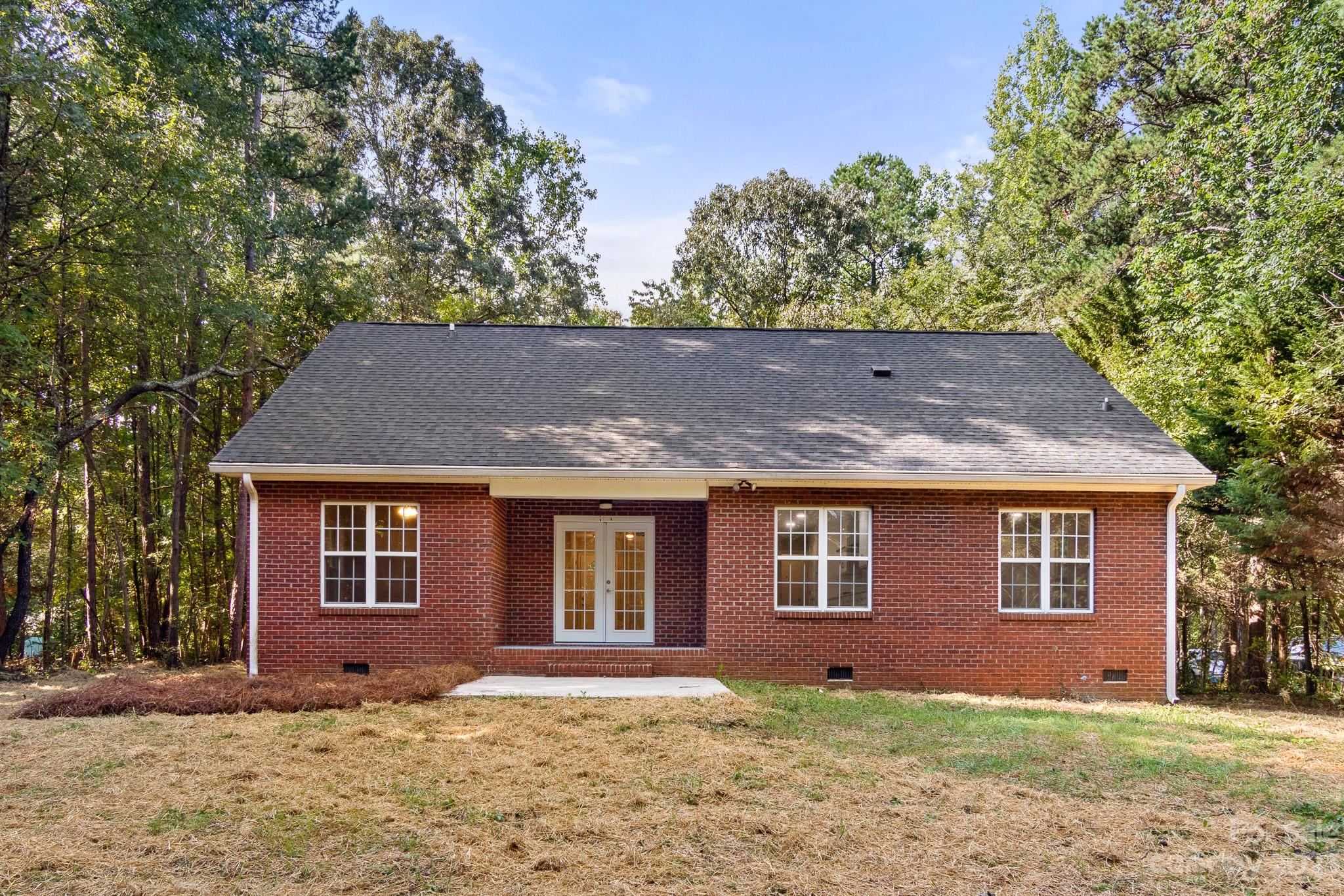 313 Faith Road Mooresville, NC 28115 - Photo 38 of 42 a front view of a house with a yard