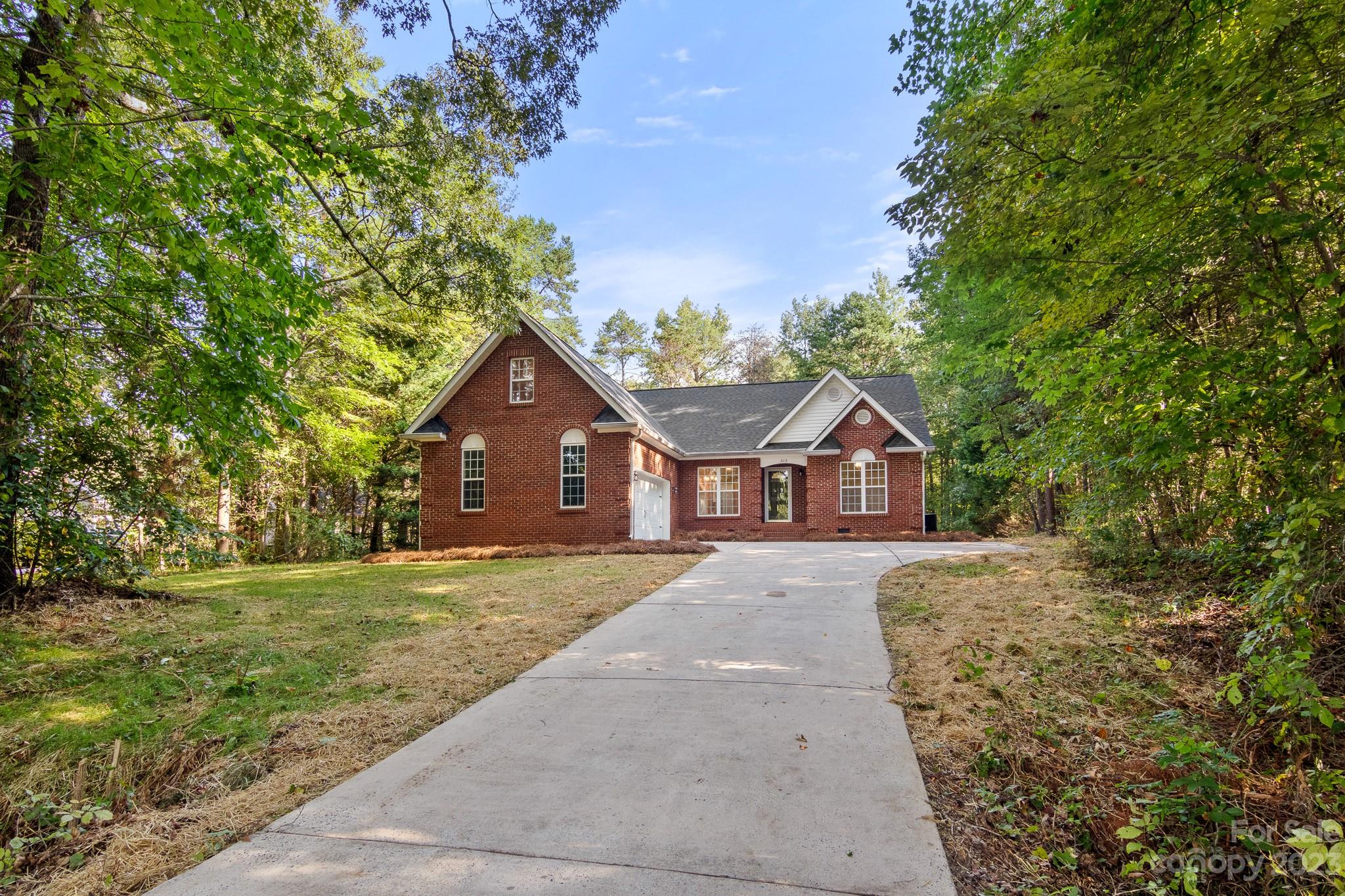 313 Faith Road Mooresville, NC 28115 - Photo 41 of 42 front view of a house with a yard