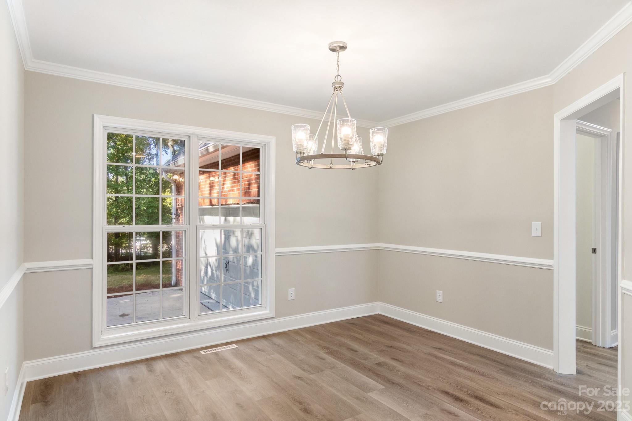 313 Faith Road Mooresville, NC 28115 - Photo 7 of 42 a view of empty room with wooden floor and fan