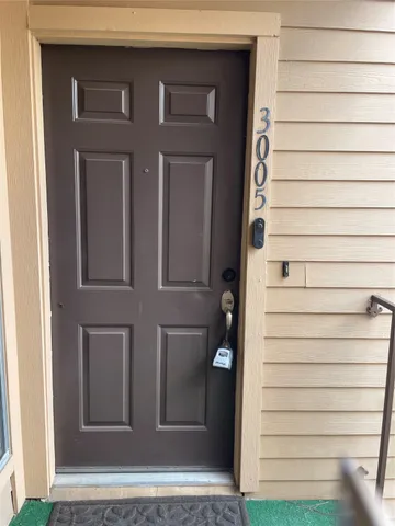 a kitchen with stainless steel appliances granite countertop a sink and a refrigerator