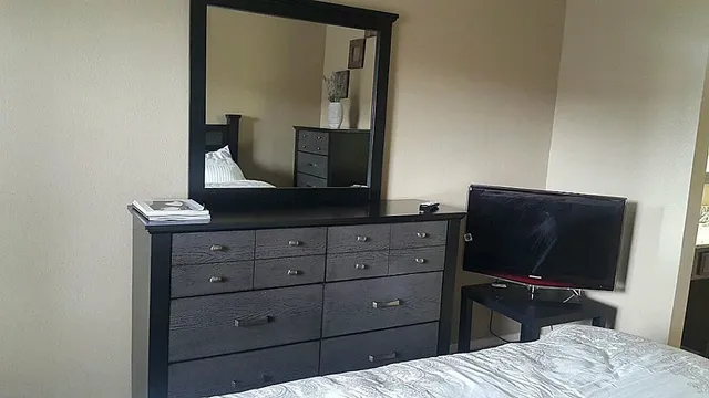 a bathroom with double vanity sink and a mirror