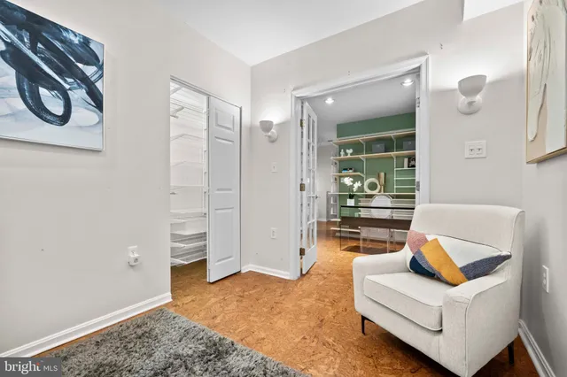 a living room with furniture and a rug