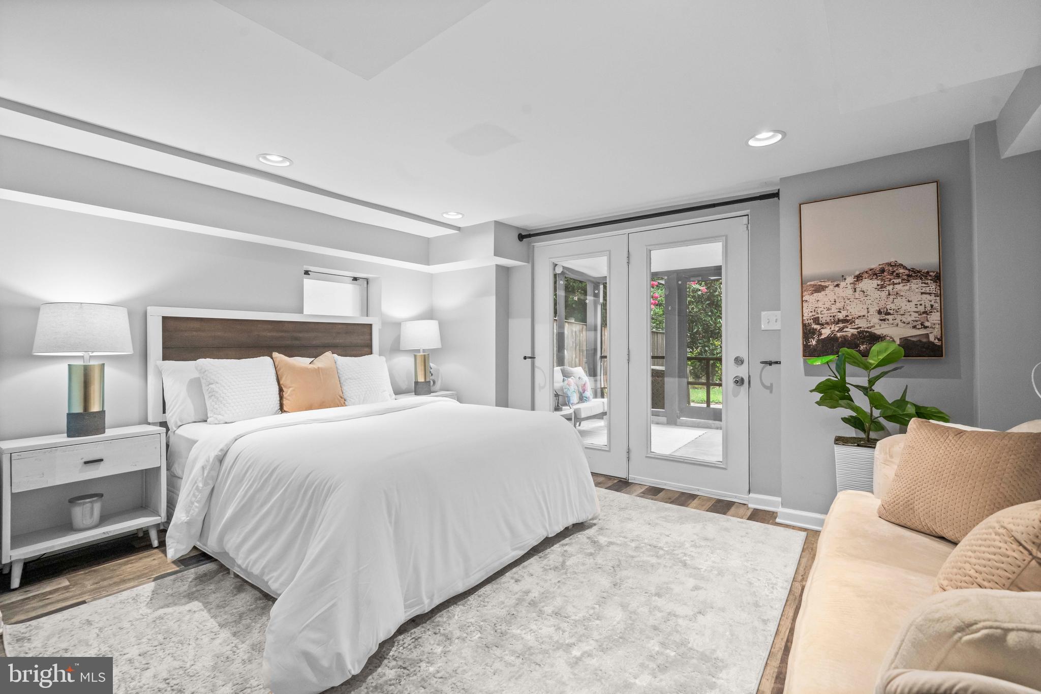 1348 Newton Street Northeast Washington, DC 20017 - Photo 15 of 31 a bedroom with a large bed and a couch