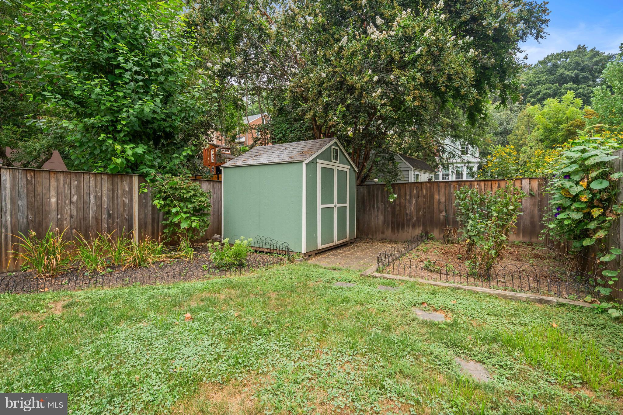 1348 Newton Street Northeast Washington, DC 20017 - Photo 27 of 31 a view of a backyard with plants and tree