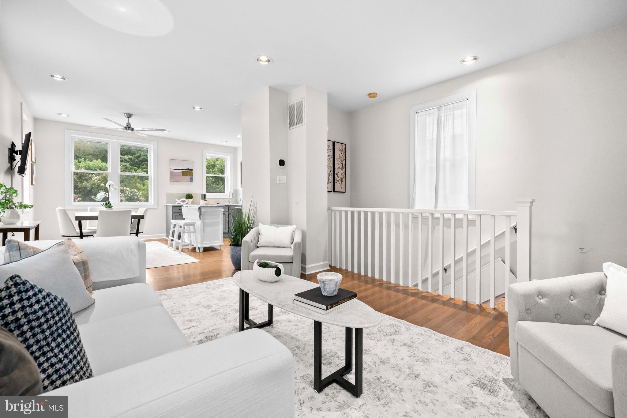 1348 Newton Street Northeast Washington, DC 20017 - Photo 3 of 31 a living room with furniture and a table
