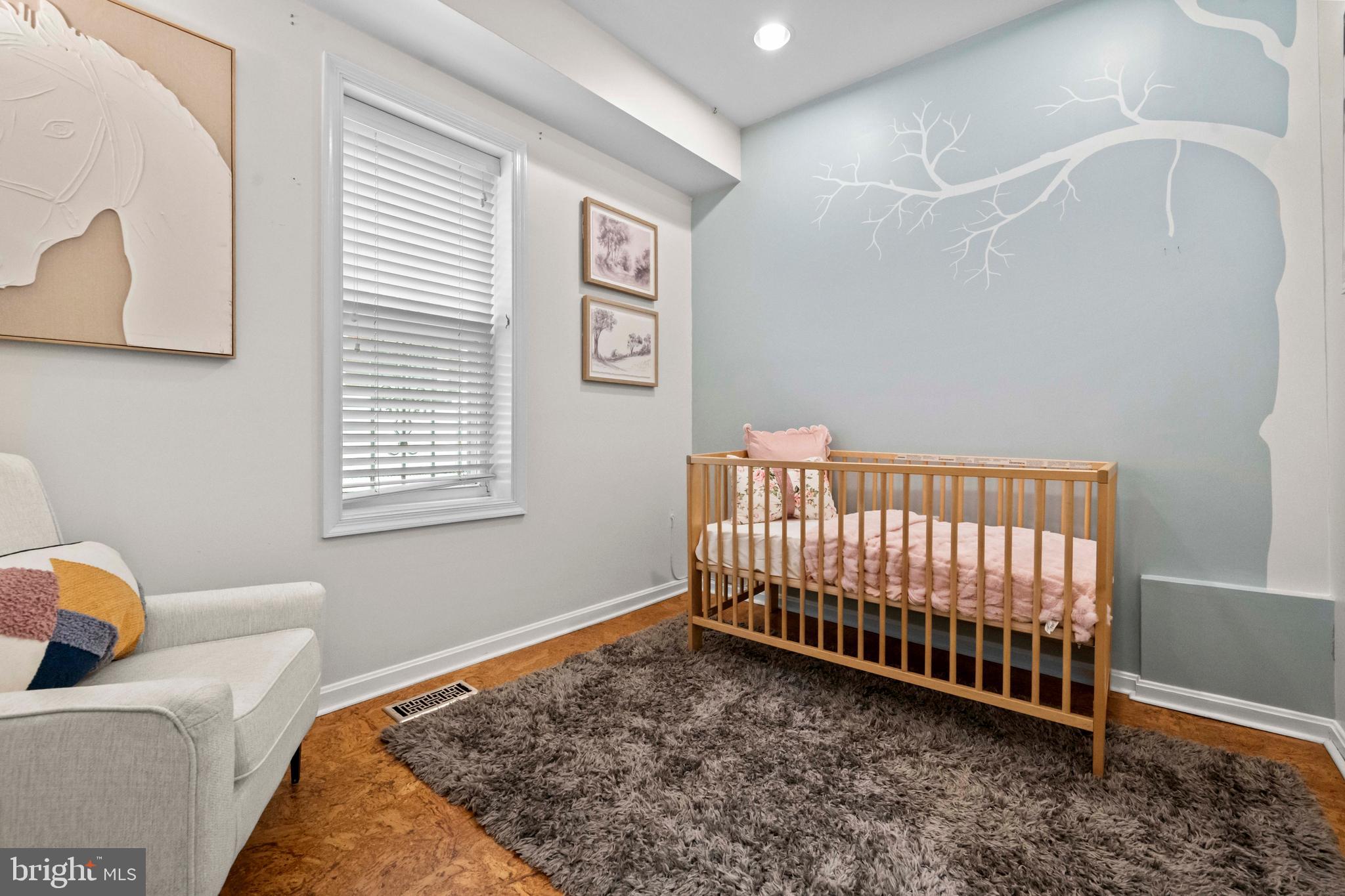 1348 Newton Street Northeast Washington, DC 20017 - Photo 10 of 31 a bed sitting in a bedroom next to a window
