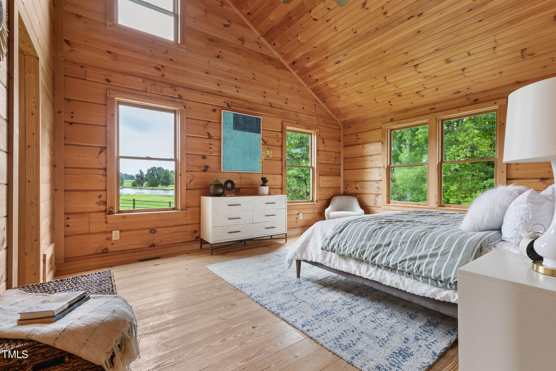4676 Uzzle Road Rougemont, NC 27572 - Photo 29 of 74 a bed sitting in a bedroom next to a window