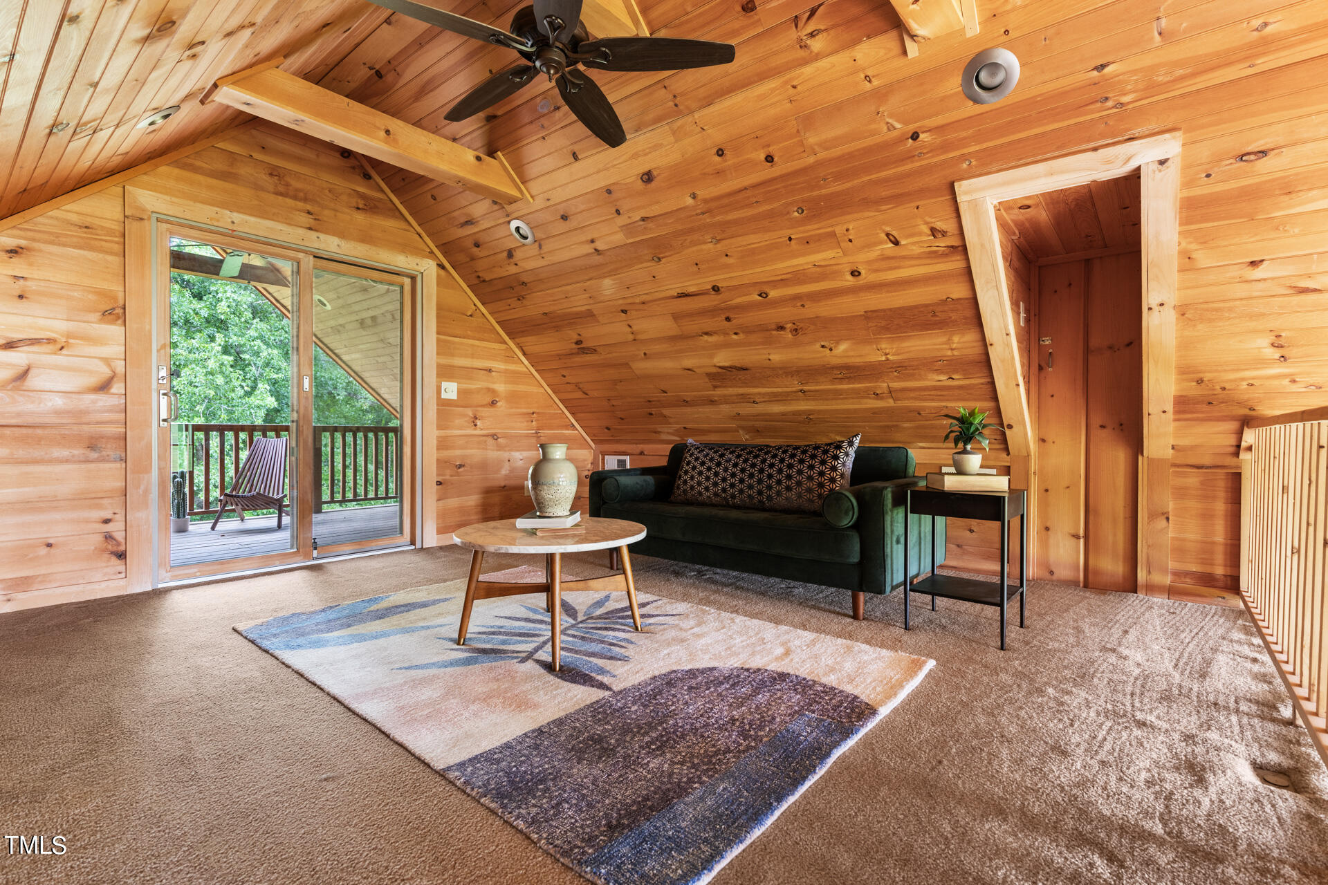 4676 Uzzle Road Rougemont, NC 27572 - Photo 43 of 74 a living room with patio furniture and a wooden floor