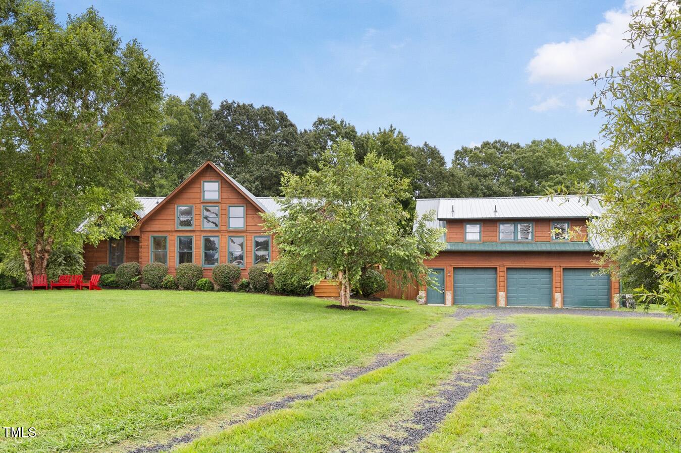 4676 Uzzle Road Rougemont, NC 27572 - Photo 5 of 74 a front view of a house with a yard