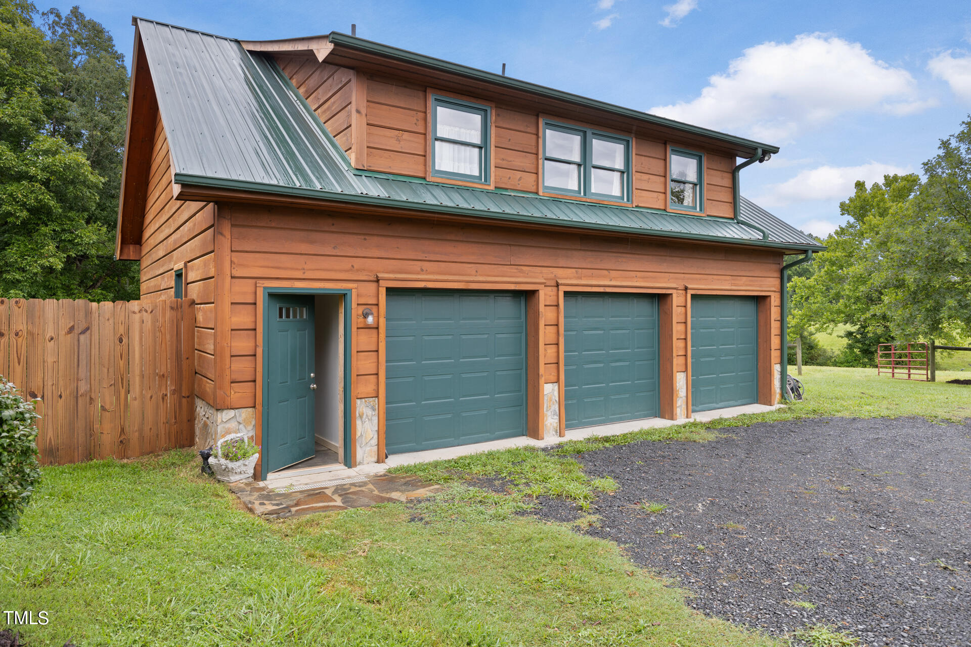 4676 Uzzle Road Rougemont, NC 27572 - Photo 51 of 74 a front view of a house with a garden and yard