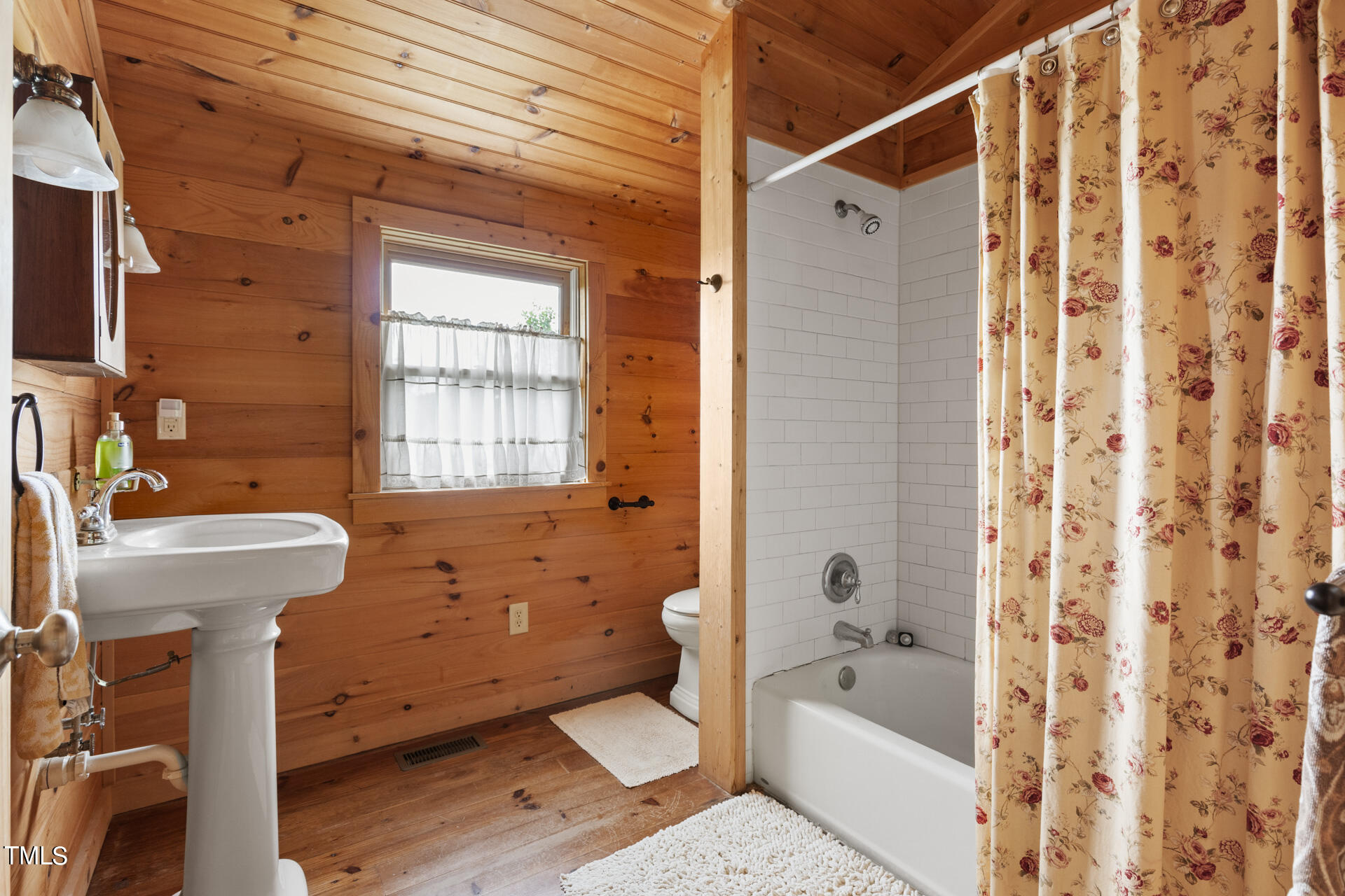 4676 Uzzle Road Rougemont, NC 27572 - Photo 57 of 74 a bathroom with a sink a toilet and shower