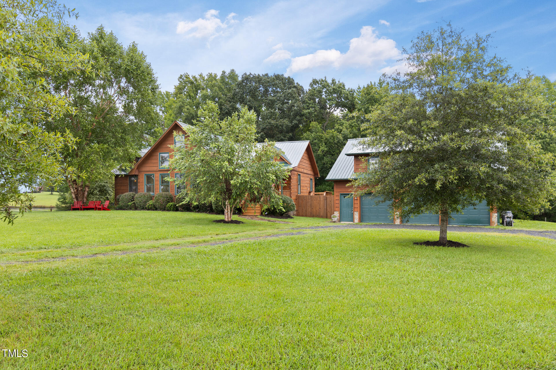 4676 Uzzle Road Rougemont, NC 27572 - Photo 6 of 74 a front view of a house with a yard