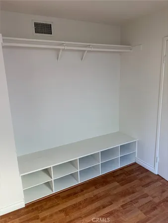 a view of an empty walk in closet