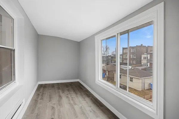 a view of a room with a large window