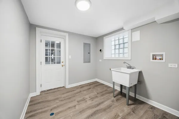 a view of a room with wooden floor and workspace