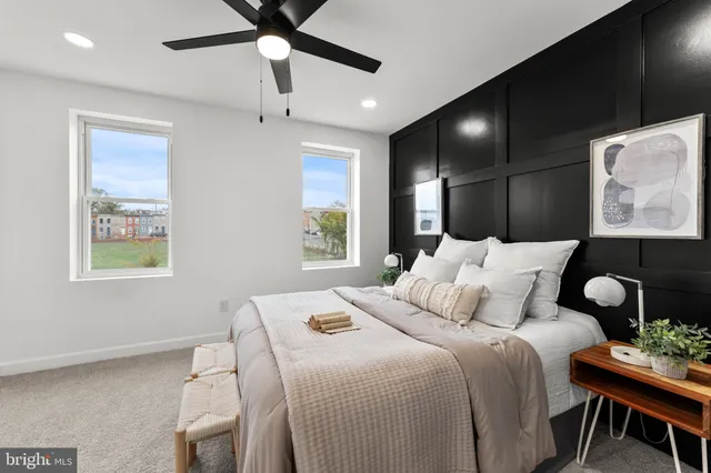 a bedroom with a bed and a window