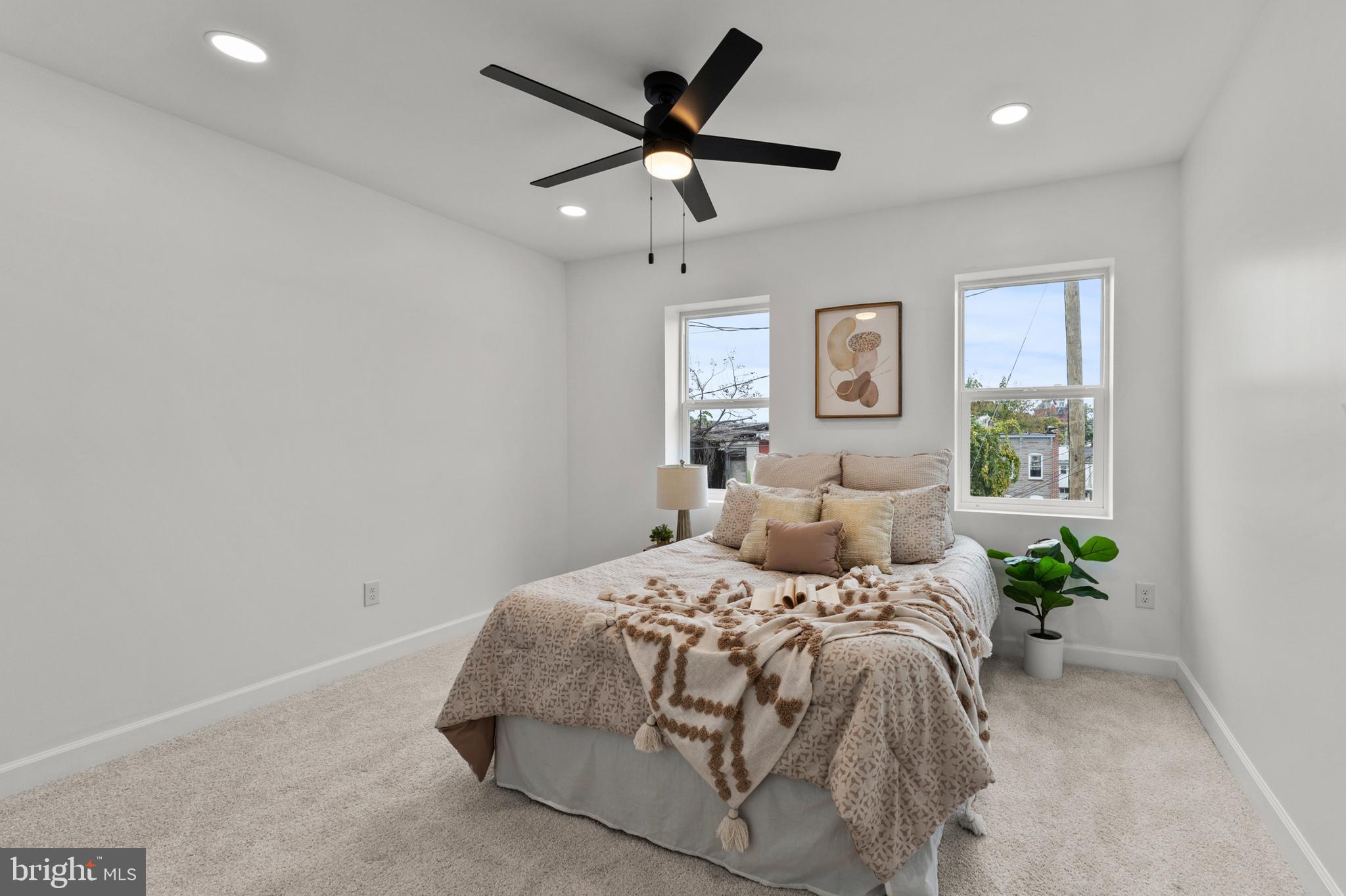 1623 Rutland Avenue Baltimore, MD 21213 - Photo 29 of 38 a bedroom with a bed and window