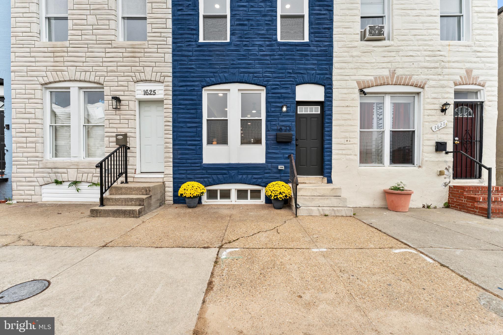 1623 Rutland Avenue Baltimore, MD 21213 - Photo 3 of 38 a view of building with glass top table and chairs