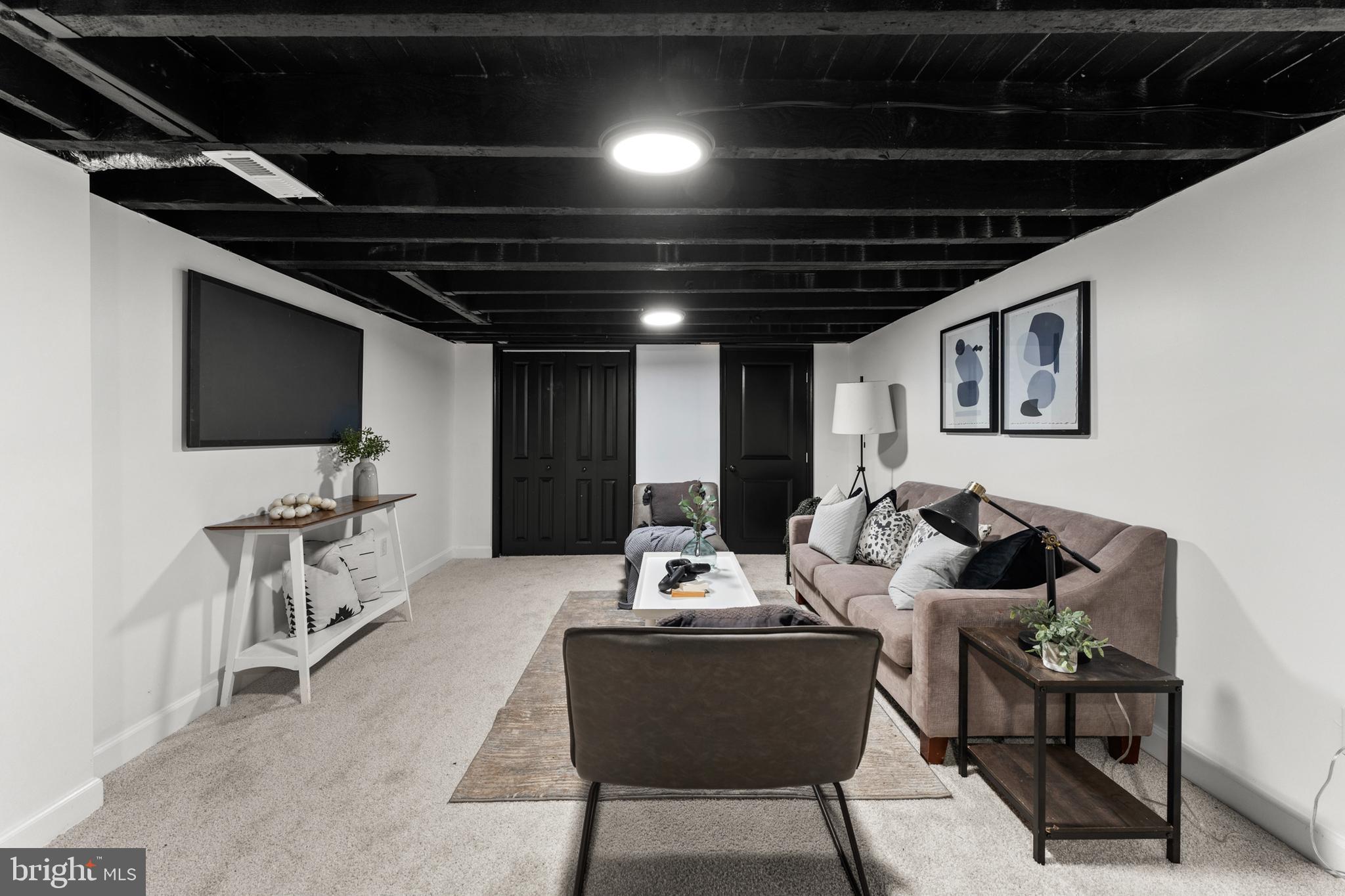 1623 Rutland Avenue Baltimore, MD 21213 - Photo 31 of 38 a living room with furniture and a flat screen tv