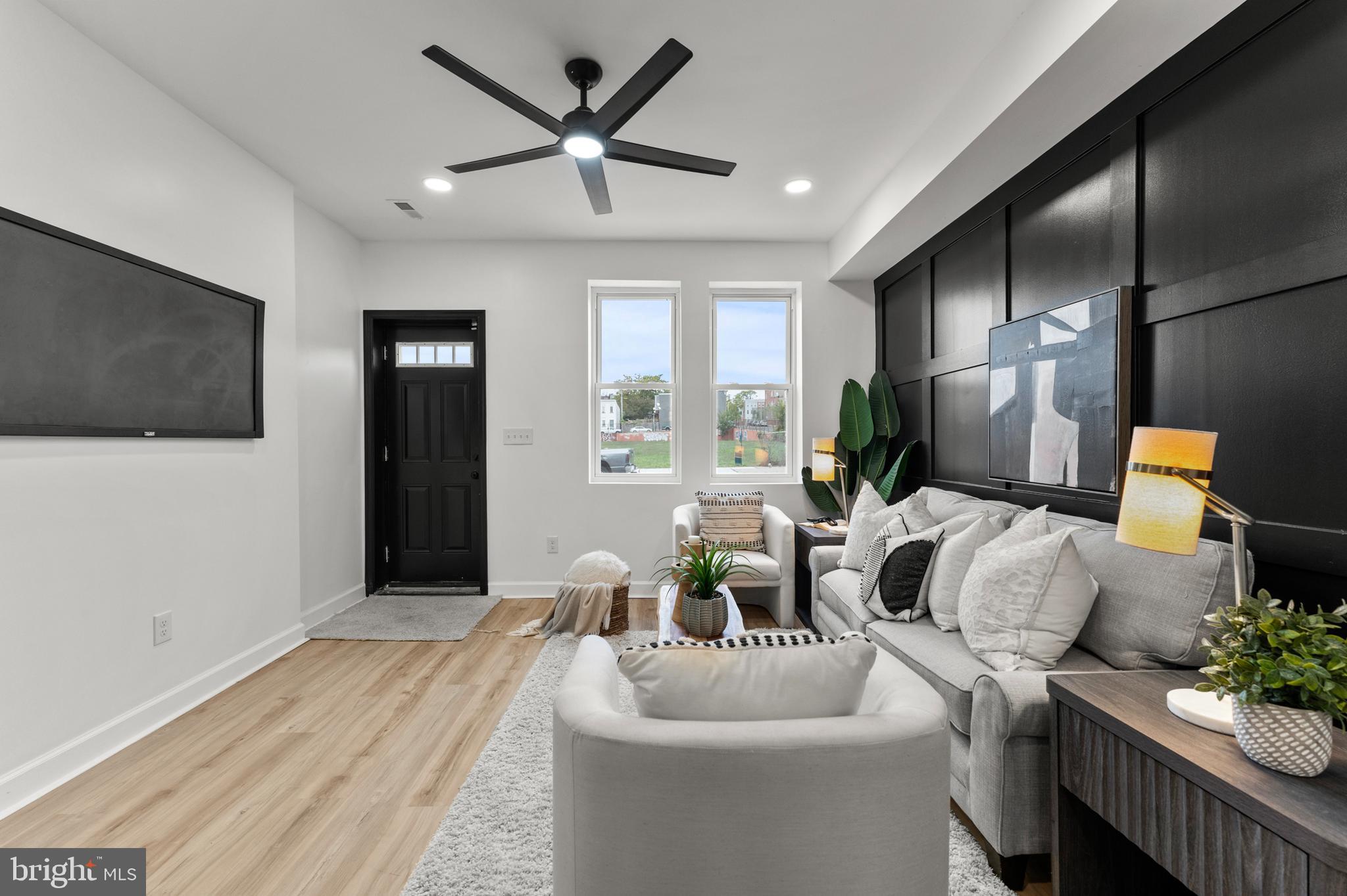 1623 Rutland Avenue Baltimore, MD 21213 - Photo 4 of 38 a living room with furniture and a flat screen tv