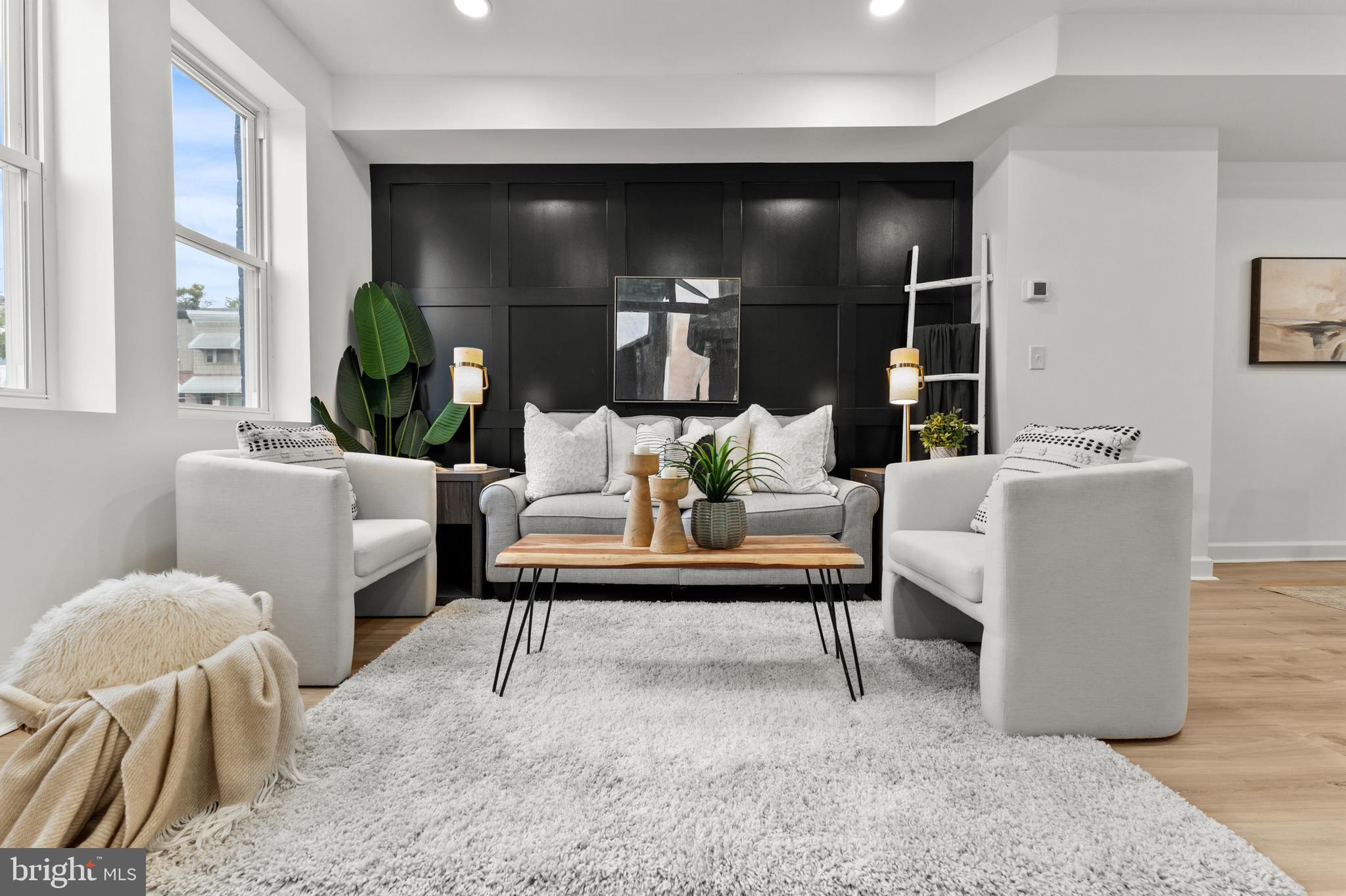 1623 Rutland Avenue Baltimore, MD 21213 - Photo 7 of 38 a living room with furniture and a potted plant
