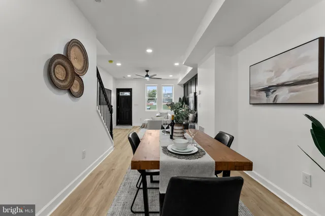 a view of a dining room with furniture and front door